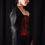 Red silk corset and embroidered black gown