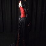 Red silk corset and embroidered black gown