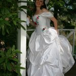 White silk corseted wedding gown with embroidered flowers