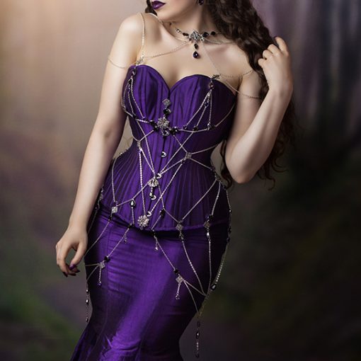 La Esmeralda purple silk corset and fishtail skirt with silver chain and crystal web