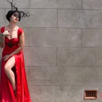 Arien, layered red gown, with twisted black horns with crytals and a black lace veil.